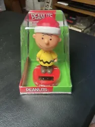 Peanuts Charlie Brown Solar Bobbler Christmas Bobble Head Figure NEW Santa Hat. Has a small crack in the front part of...