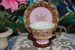 Courting couples. Both pieces have their original stickers on the. pattern tea cup and saucer from Lefton. There are...