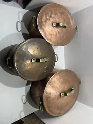 This antique copper cookware set includes three nesting pots that are ideal for decoration or use in the kitchen. The...