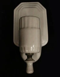 Marked with the sticker of Porcelier. Slots for outlet on bottom of lamp. Twist switch on bottom.