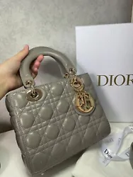 Stone grey, calfskin, Cannage quilted effect, detachable and adjustable crossbody strap, two rounded top handles, Dior...