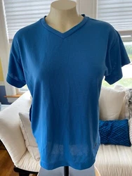 In excellent condition. Has fairly deep pocket on right back. 49% polyester, 43% vinal, 8% nylon. Made in the USA.