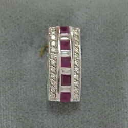 0.60 CT Ruby pendant with 1/3 CTW diamond accents.