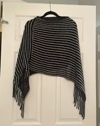 This poncho is in great condition! Would probably fit small to medium.