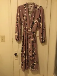 Good condition. Long sleeves with elastic at wrist, (faux) wrap style. Slight puff at shoulders, belt. Note one side of...