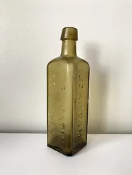 Udolpho Wolfe’s Aromatic Schnapps Antique Vintage Bottle Olive Green Yellow. Schiedam, Netherlands. The bottle is a...
