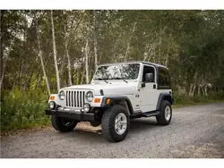 2006 Jeep Wrangler- 6 Speed Manual, 110,000 miles, White on Dark Slate Grey interior. All original booklets and VHS...