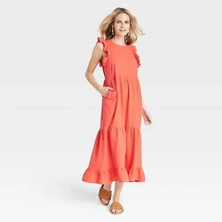 •Flutter short-sleeve midi dress •100% cotton fabric •Ruffled crew neckline •Functional side pocket •Tiered...