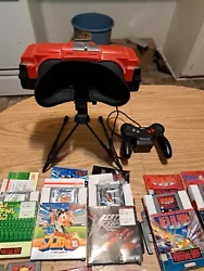Virtual Boy System And Game Lot. THERE is writings on teleroboxer instruction booklet and Mario tennis and some of the...