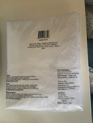 Middle layer: waterproof vinyl. Machine wash, tumble dry low. Top and bottom layers: polyester.