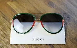 Gucci GG0062S 003. Lens width: 57mm. Lens color: Gray.