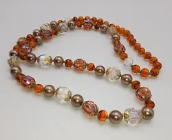 Vintage Amber & Crystal Glass Necklace. Beautiful beads. All glass except the bronze colored round. Very nice...