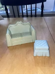 Couch and ottoman from vintage set. They have aged differently, and they are different shades of blue as you can see in...