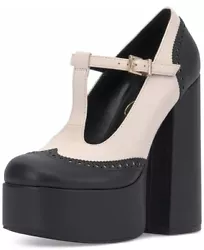 A contrasting upper enhances the brogued wingtip and heel of this towering platform mary jane pump.