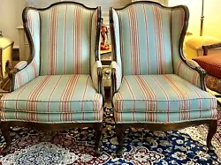 A Pair of French Country style striped upholstered Wood Framed Wingback chairs. These were vintage and reupholstered...