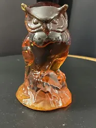 He is an Amber glass color. Condition is new.