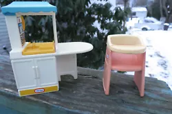 This is a childs dollhouse set of Little Tikes furniture which includes a highchair and a stove with oven, sink, yellow...