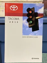 This is a quick reference guide owners manual supplement book for a 2013 Toyota Tacoma. It contains information...