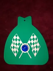 MUDFLAP IN GREEN WITH GREEN & WHITE CHECKERED CROSS FLAGS AND RED JEWEL. YOU GET ONE MUDFLAP IN GREEN. WITH CHECKERED...