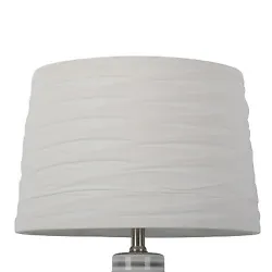 •Ivory white drum lampshade offers a timeless look •Overlapping fabric accent adds dimension and texture to your...