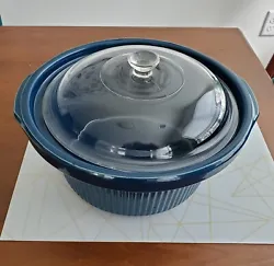 The set includes the blue stoneware liner and glass lid.  No chip or cracks.