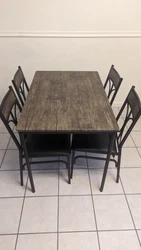 Metal table with four chairs, like new used, local pickup only.