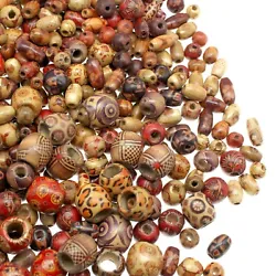 Colorful bulk wooden beads for crafts with lightly painted and stained pattern designs. 500 total assorted wood beads...