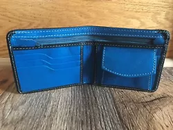 Color : Black and Blue ( See the Photos ). 2 Hidden pocket behind the credit/bank card slot. 1 coin pocket with snap. 2...