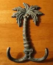 Rustic Double Hook Palm Tree . Materials: Made of cast iron with rustic gold textured finish this piece has an...