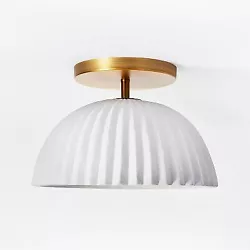 •Decorative ceramic ceiling light spruces up the look of any space •Scalloped white and brass ceiling light lends...