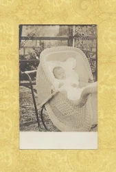 TAKE a look at this baby in an antique wicker baby stroller! Great piece of local history!