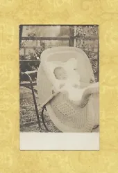 TAKE a look at this baby in an antique wicker baby stroller! Great piece of local history!