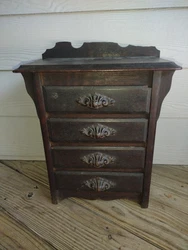 It maintains its original finish and is in good overall condition. The bottom dust board underneath is a little loose.