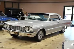 See all 70+ photos of this fabulous Impala!  This 64 Impala Super Sport oozes 60s muscle car style with its legendary...