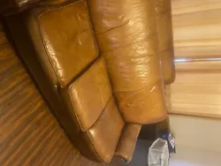 This used leather sofa couch is spacious and comfortable. It fits in every living room.