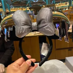 The headband was never used, but there may be small orginal scratches on surface of headband. item buy from disney park.