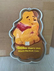 MADE IN USA BY WILTON(1976). ALUMINUM CAKE PAN WITH INSERT & DIRECTIONS.
