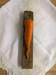 The item is sold as is, as found and as you see it. The sale is for a Carol Cline ceramic carrot on vintage barn wood....