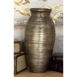 Suitable for indoor use only. Made in Vietnam. This is a single brown colored vase. Traditional style. Vase has a 5.50...