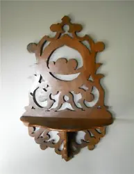 This is a ornate fretwork shelf. Im not sure what type of wood its made out of, I would guess pine or walnut. Wall...