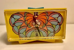 A cool Peter Max alarm clock made by GE in the late 1960s. Decoration: A Butterfly decorates the face of this clock....