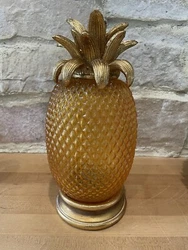 Large pineapple glass with resin base. On bottom you can turn on to light up