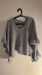 Elevate your wardrobe with this Anthropologie Moth Gray Pullover Poncho Sweater in size M/L. Crafted from high-quality...