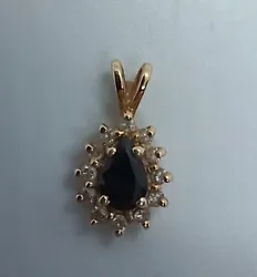 14k gold black onyx diamond Pendant. Beautiful pictures dont capture the beauty.  ESTATE needs a good cleaning.