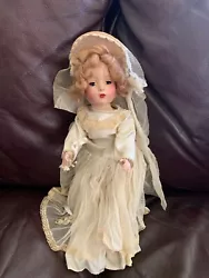 I believe this to be the 14” vogue Peggy doll in her bridal gown. She is all original down to her shoes and socks....