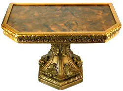 A vintage gold Hollywood Regency small side table, a set of four wing turn clips hold the top to the base, top is...