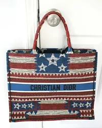 This is the large size book tote. Embroidered red, white & blue USA flag. Made of canvas. No Interior lining. Top...