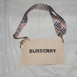 The wristlet is an authentic Burberry beauty fragrance pouch. Strap can be removed all together and we worn as a...