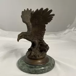 This is a beautiful bronze sculpture of an eagle. The eagle is 10.5