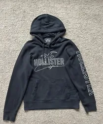 Elevate your casual style with this black Hollister hoodie for men. Crafted with high-quality material, this pullover...